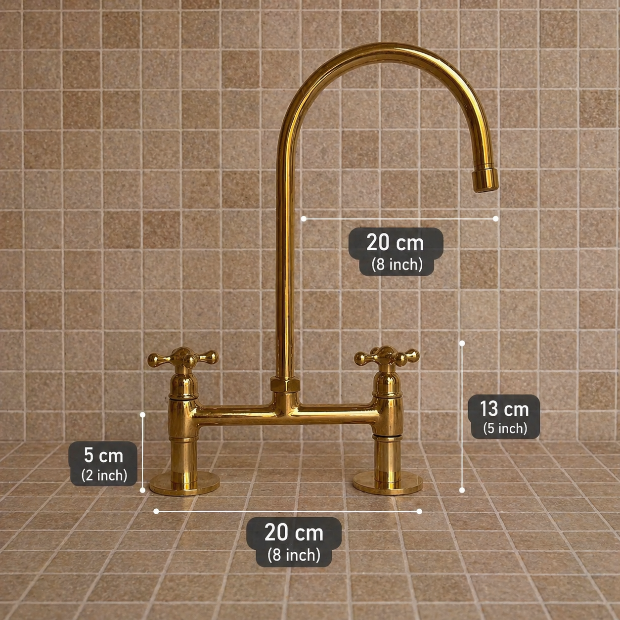 A brass bridge faucet with two handles and a high-arc spout, shown against a beige tiled backsplash with overlaid dimension labels indicating 20 cm, 13 cm, and 5 cm measurements.