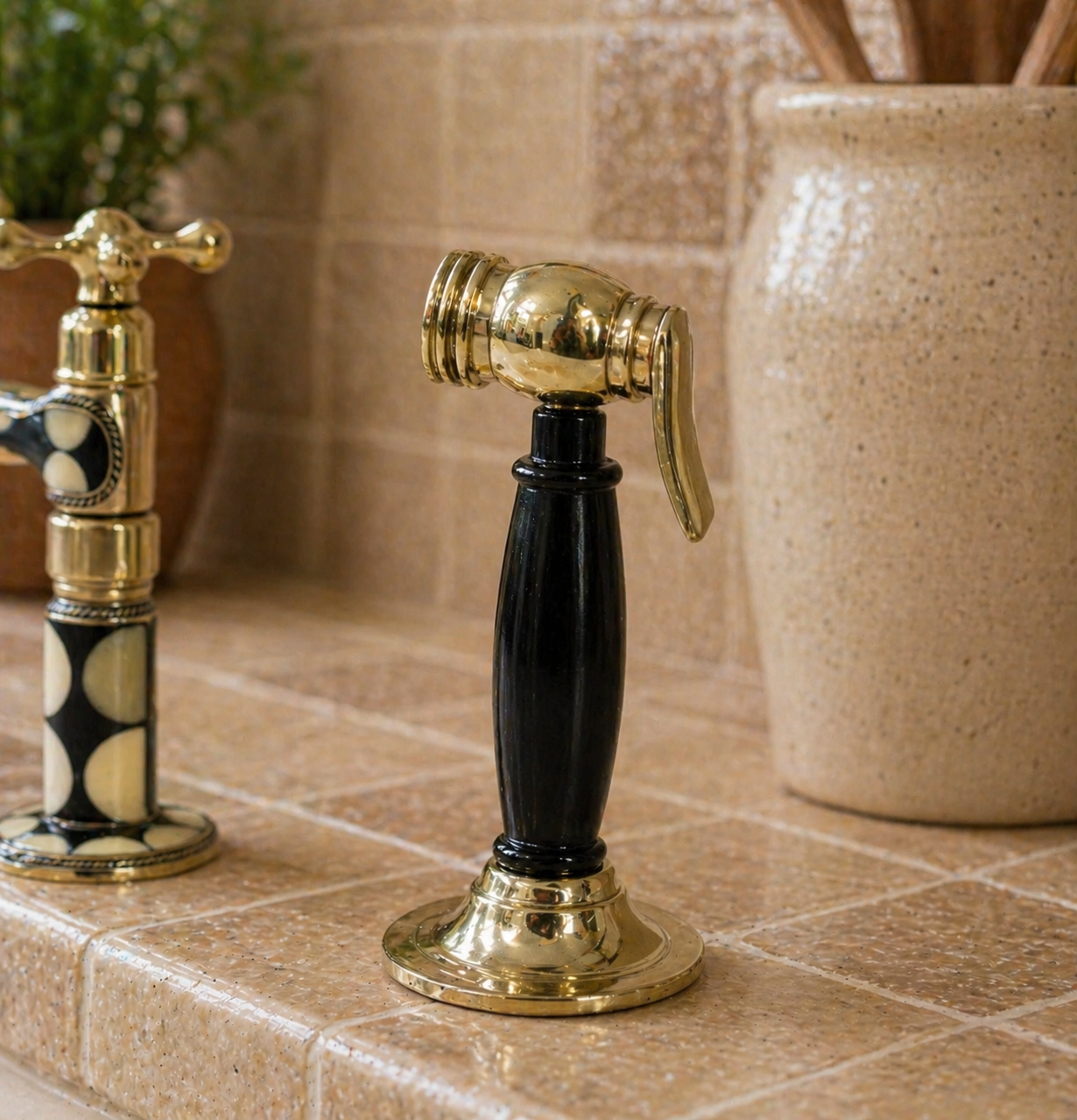 Solid brass kitchen side sprayer with black resin handle and polished brass finish