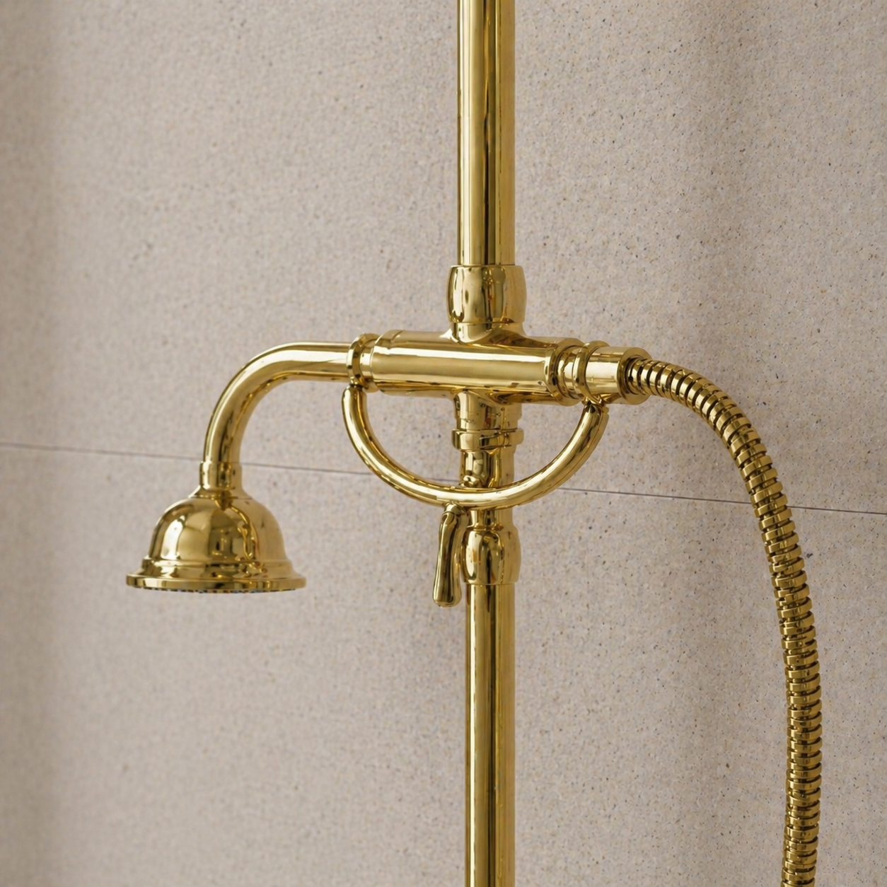 Handcrafted unlacquered antique brass exposed shower system featuring rainfall shower head, handheld shower, cross handles, and integrated tub faucet in a luxury modern bathroom