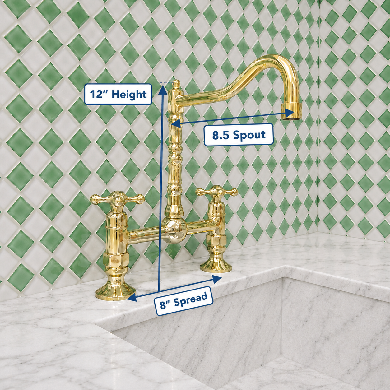 Gold bridge faucet with two cross handles and a curved spout installed on a white marble sink, shown with dimension labels for 12-inch height, 8.5-inch spout, and 8-inch spread against a green-and-white diamond tile backsplash.