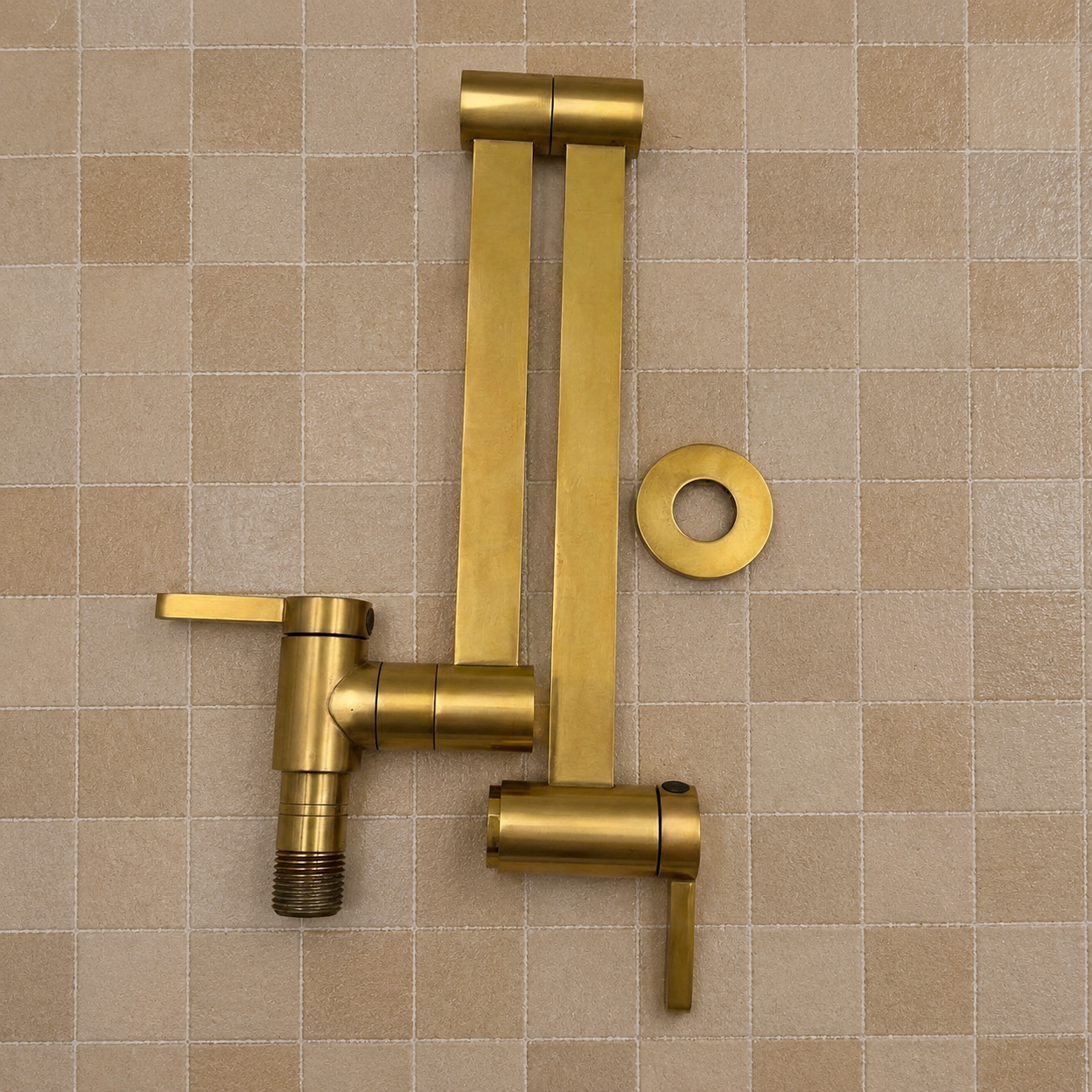 Modern handmade unlacquered solid brass wall-mounted pot filler faucet with dual swing arms and minimalist design for luxury kitchens.
