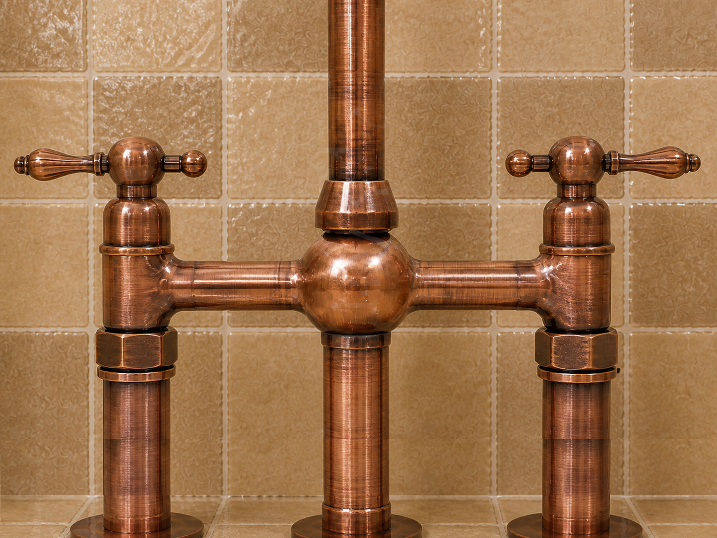 A traditional copper bridge faucet with two cross handles and polished cylindrical posts, set against a beige tiled wall.