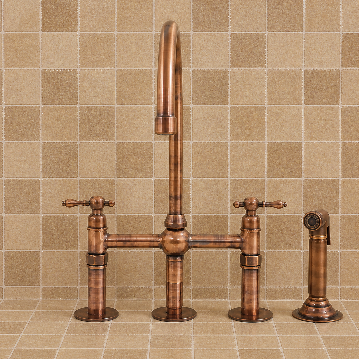 A copper bridge faucet set with a tall gooseneck spout, two cross handles, and a separate hand shower, shown against a beige tiled backsplash.