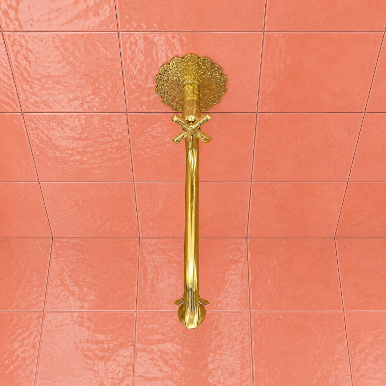 Handmade unlacquered solid brass wall-mounted pot filler faucet with curved swan-neck spout and engraved Moroccan decorative backplate.