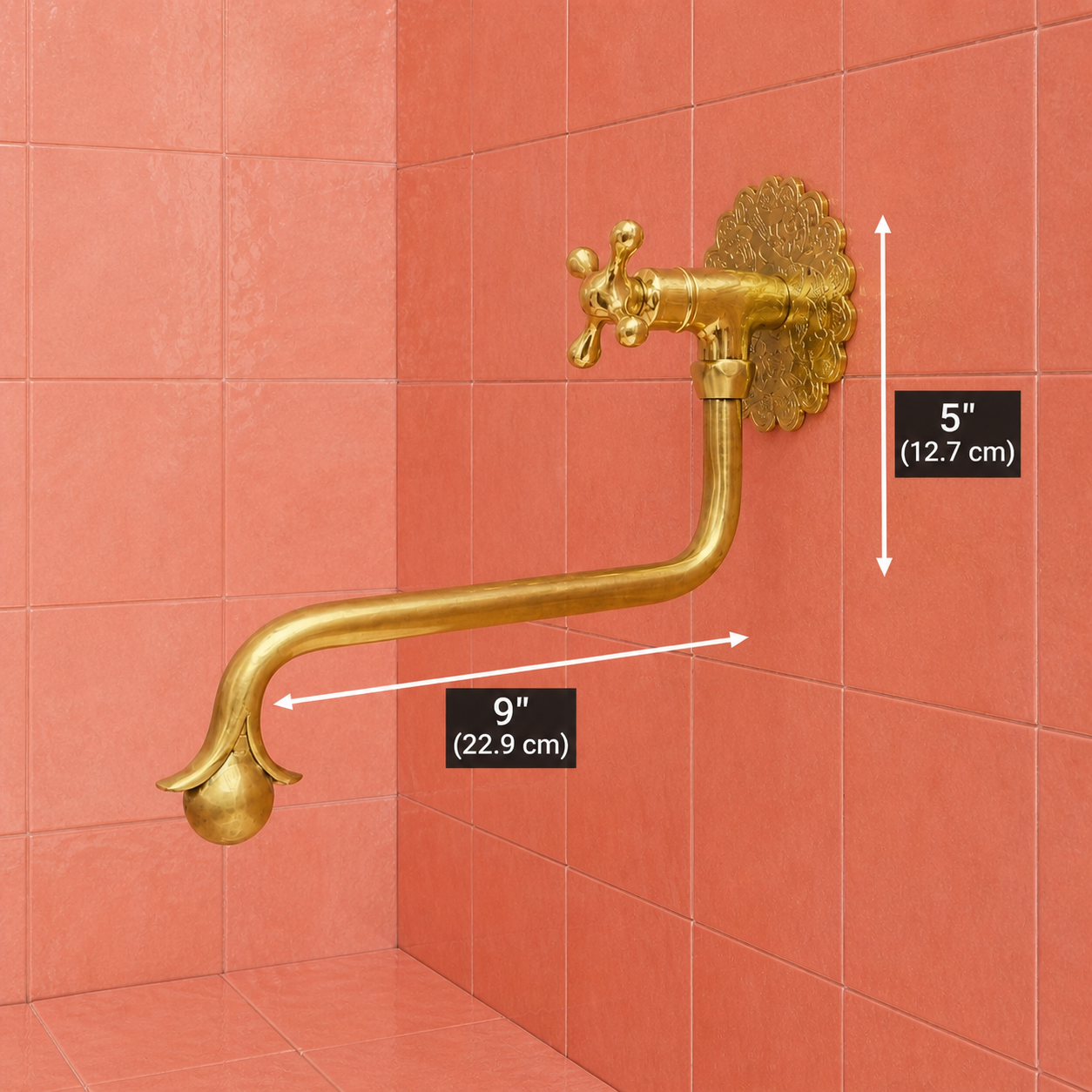 Handmade unlacquered solid brass wall-mounted pot filler faucet with curved swan-neck spout and engraved Moroccan decorative backplate.