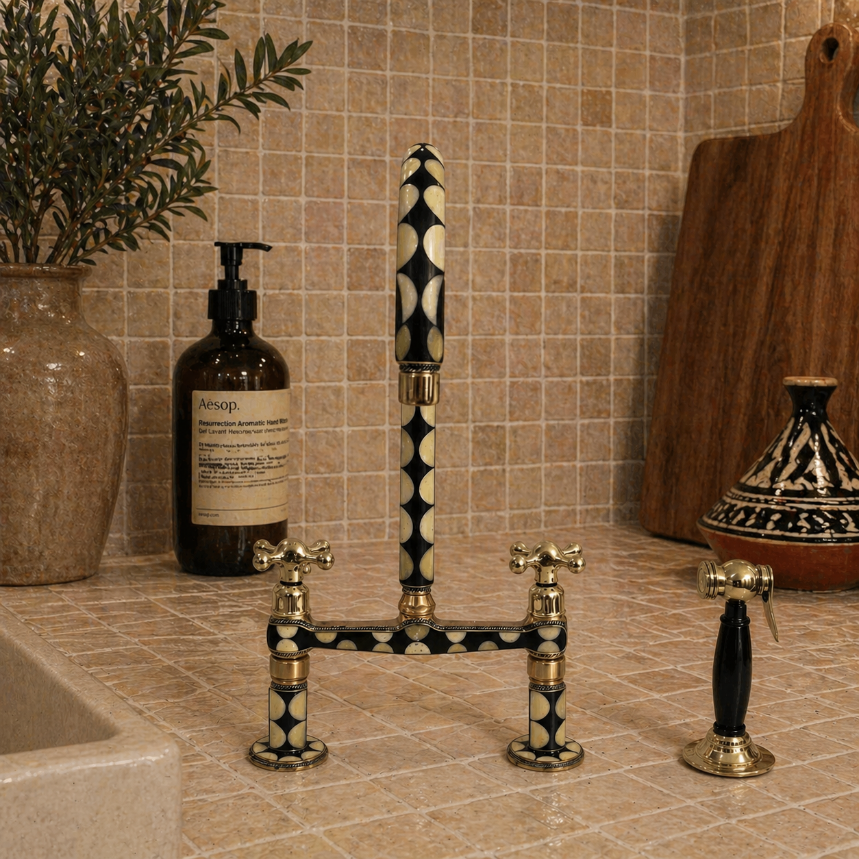 Front view of handcrafted brass bridge kitchen faucet with black and bone resin accents