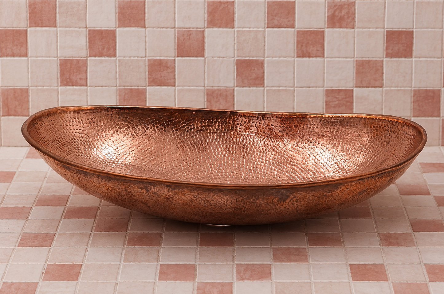 Handmade Moroccan hammered solid copper oval bathroom vessel sink with artisan hand-hammered texture.