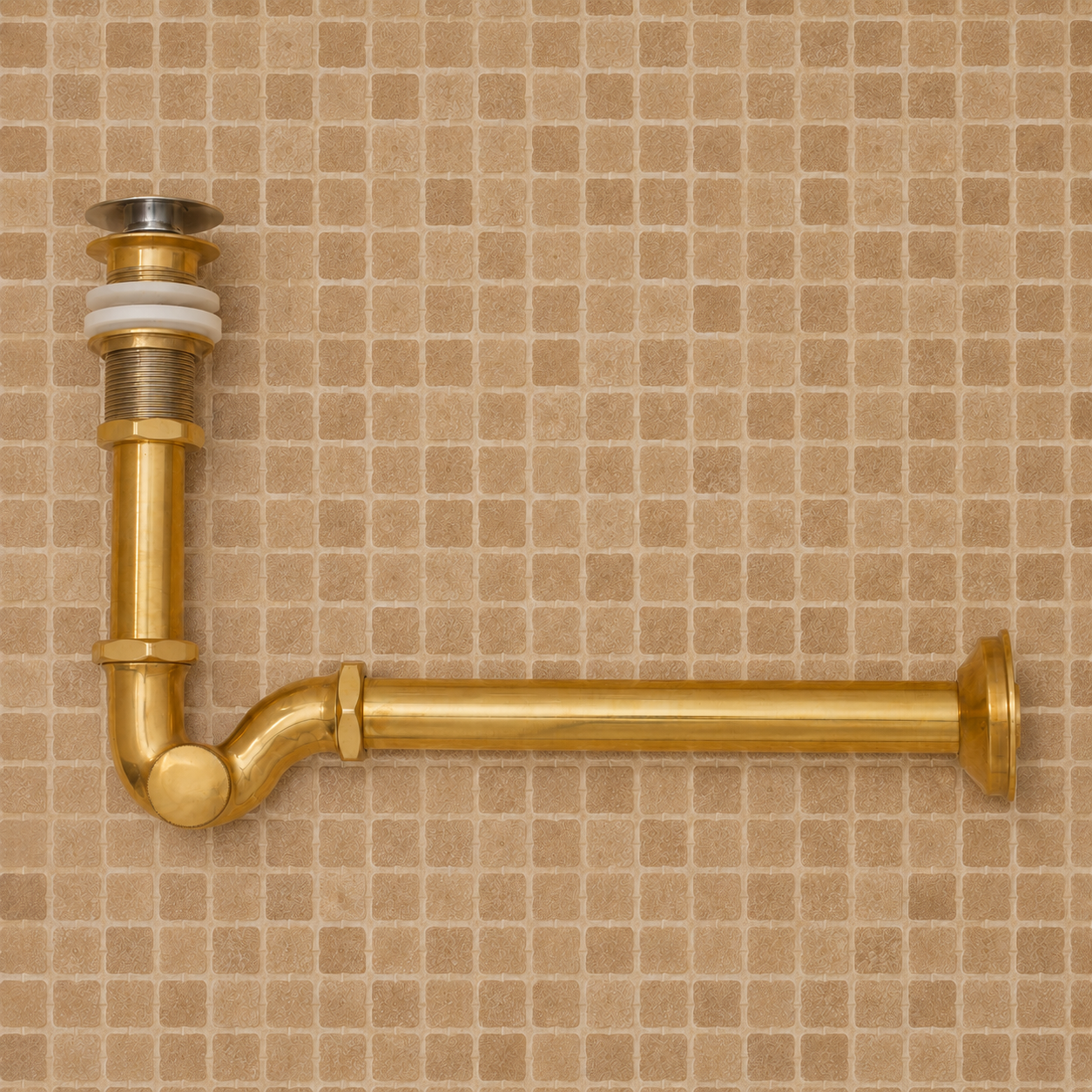 Solid unlacquered brass bathroom sink P-trap and push-button pop-up drain assembly with matching exposed plumbing components.