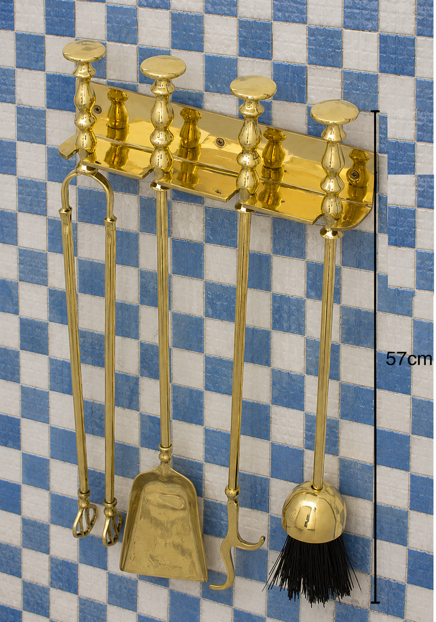 Handmade solid brass wall-mounted fireplace tool set with poker, tongs, ash shovel, brush, and storage rack.