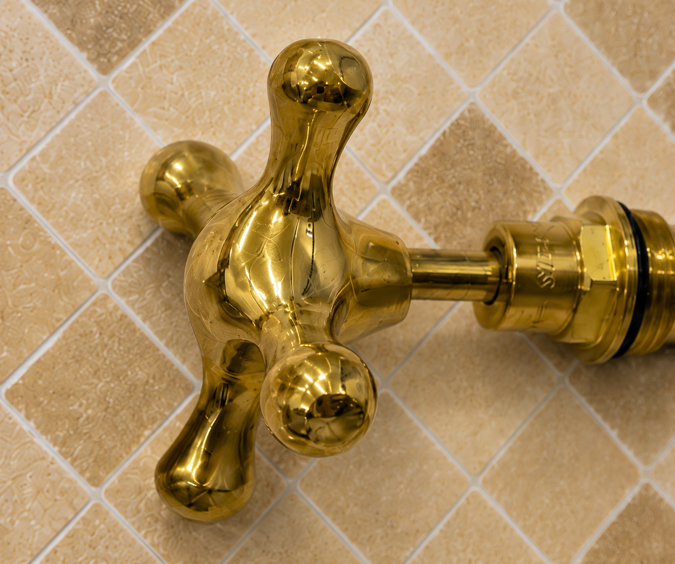 Handmade solid unlacquered brass cross faucet handle set for 1/2-inch bathroom and kitchen faucets.