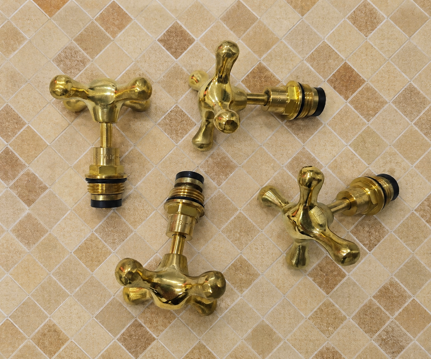 Handmade solid unlacquered brass cross faucet handle set for 1/2-inch bathroom and kitchen faucets.