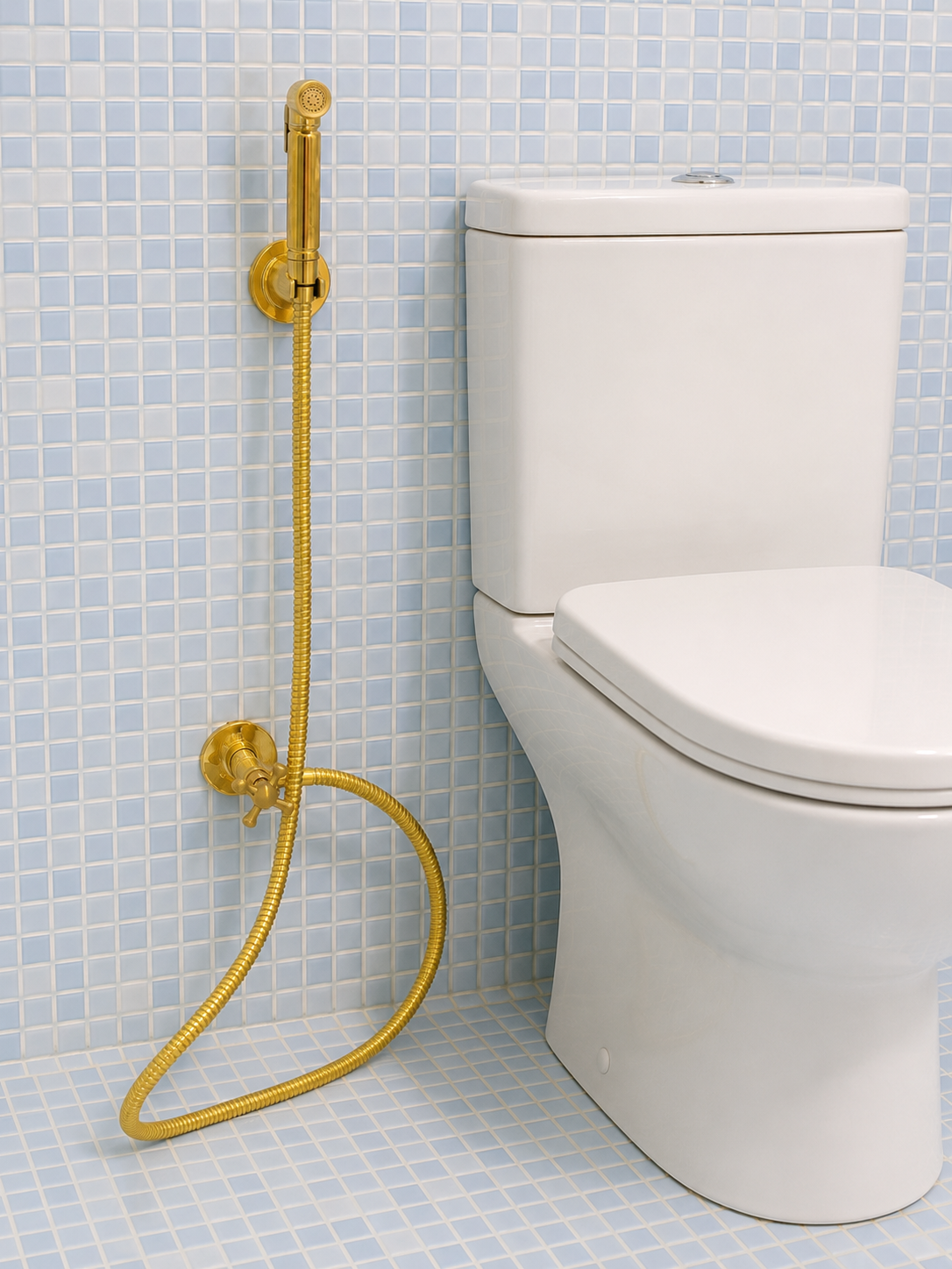 Handmade solid brass wall-mounted handheld bidet sprayer with flexible brass hose and integrated shut-off valve.