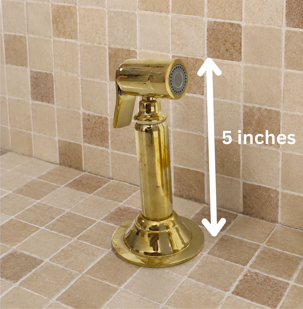 Handmade solid brass kitchen side sprayer with unlacquered finish and shut-off handle installed beside a kitchen faucet.