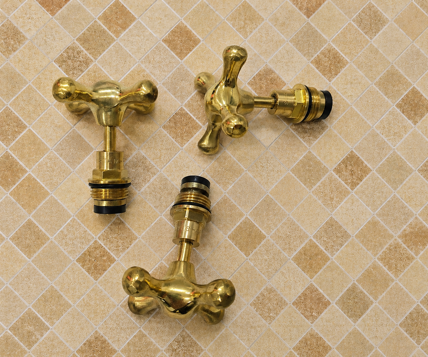 Handmade solid unlacquered brass cross faucet handle set for 1/2-inch bathroom and kitchen faucets.