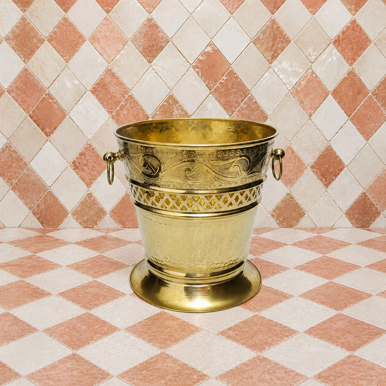 Handmade unlacquered solid brass Moroccan wastebasket with engraved decorative details and side ring handles.