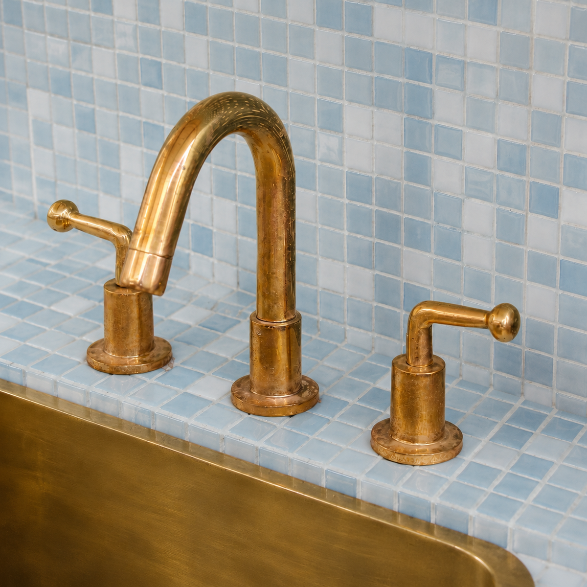 Side view of handmade solid brass bathroom faucet with widespread lever handles
