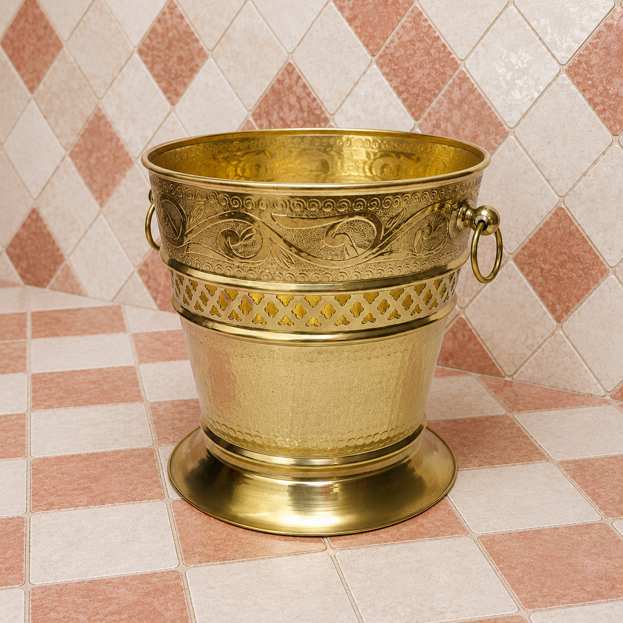 Handmade unlacquered solid brass Moroccan wastebasket with engraved decorative details and side ring handles.
