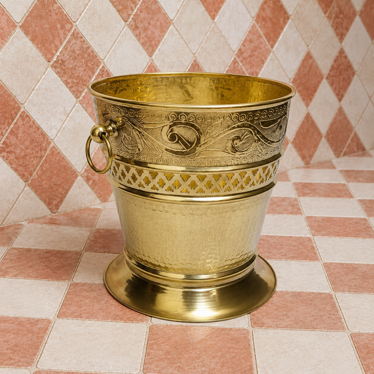 Handmade unlacquered solid brass Moroccan wastebasket with engraved decorative details and side ring handles.