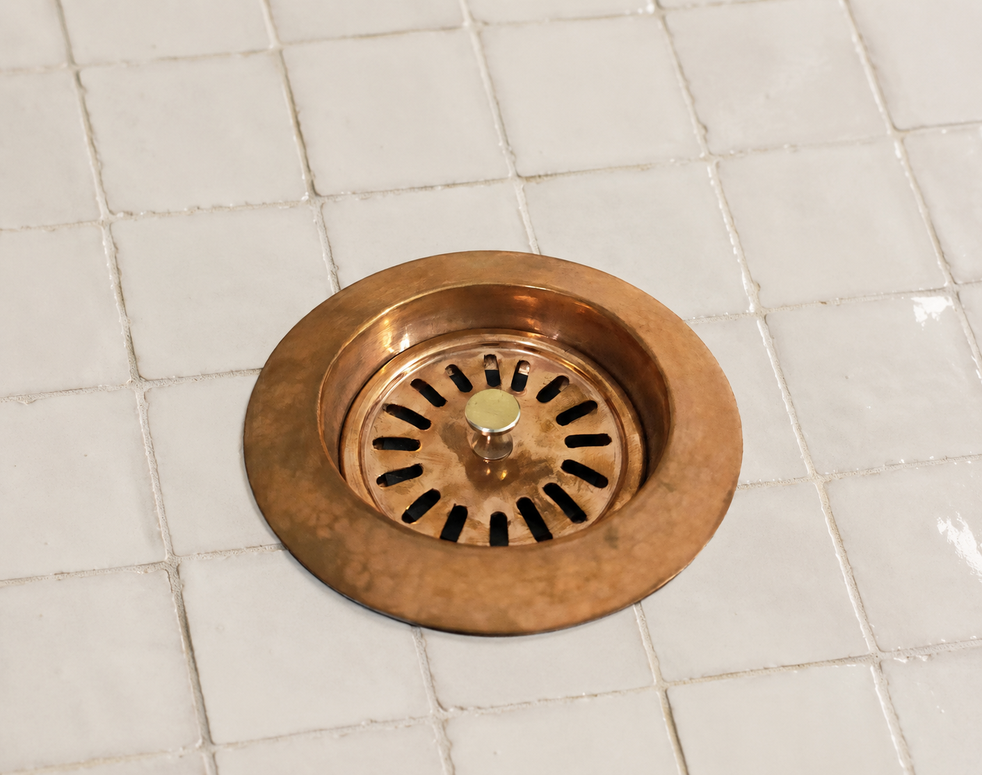 Handmade solid copper kitchen sink strainer basket drain assembly with removable basket for farmhouse and copper kitchen sinks.