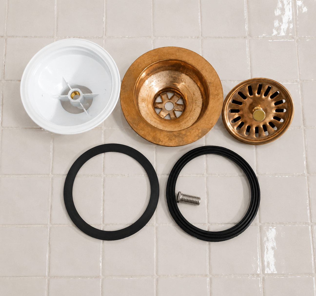 Handmade solid copper kitchen sink strainer basket drain assembly with removable basket for farmhouse and copper kitchen sinks.