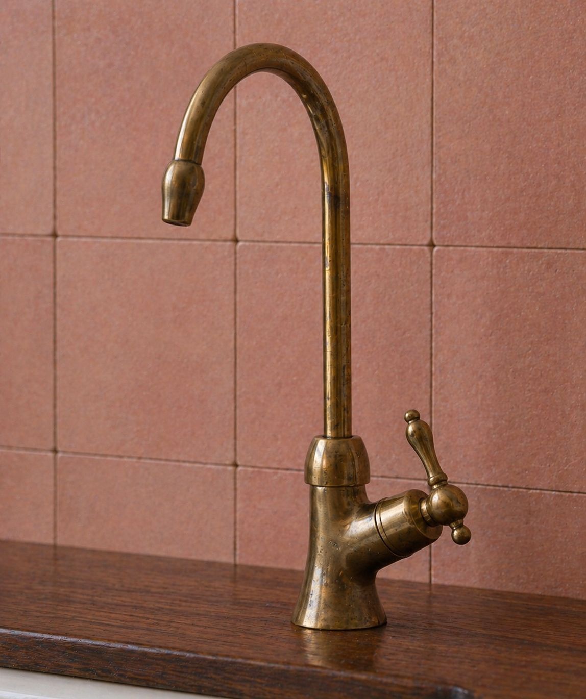 Unlacquered brass bridge kitchen faucet with cross handles and handheld side sprayer
