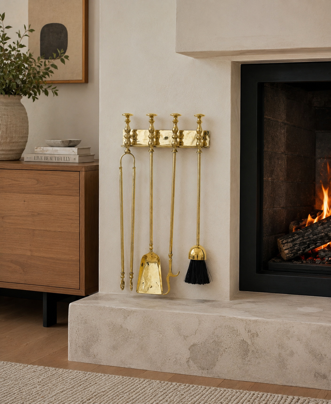 Handmade solid brass wall-mounted fireplace tool set with poker, tongs, ash shovel, brush, and storage rack.