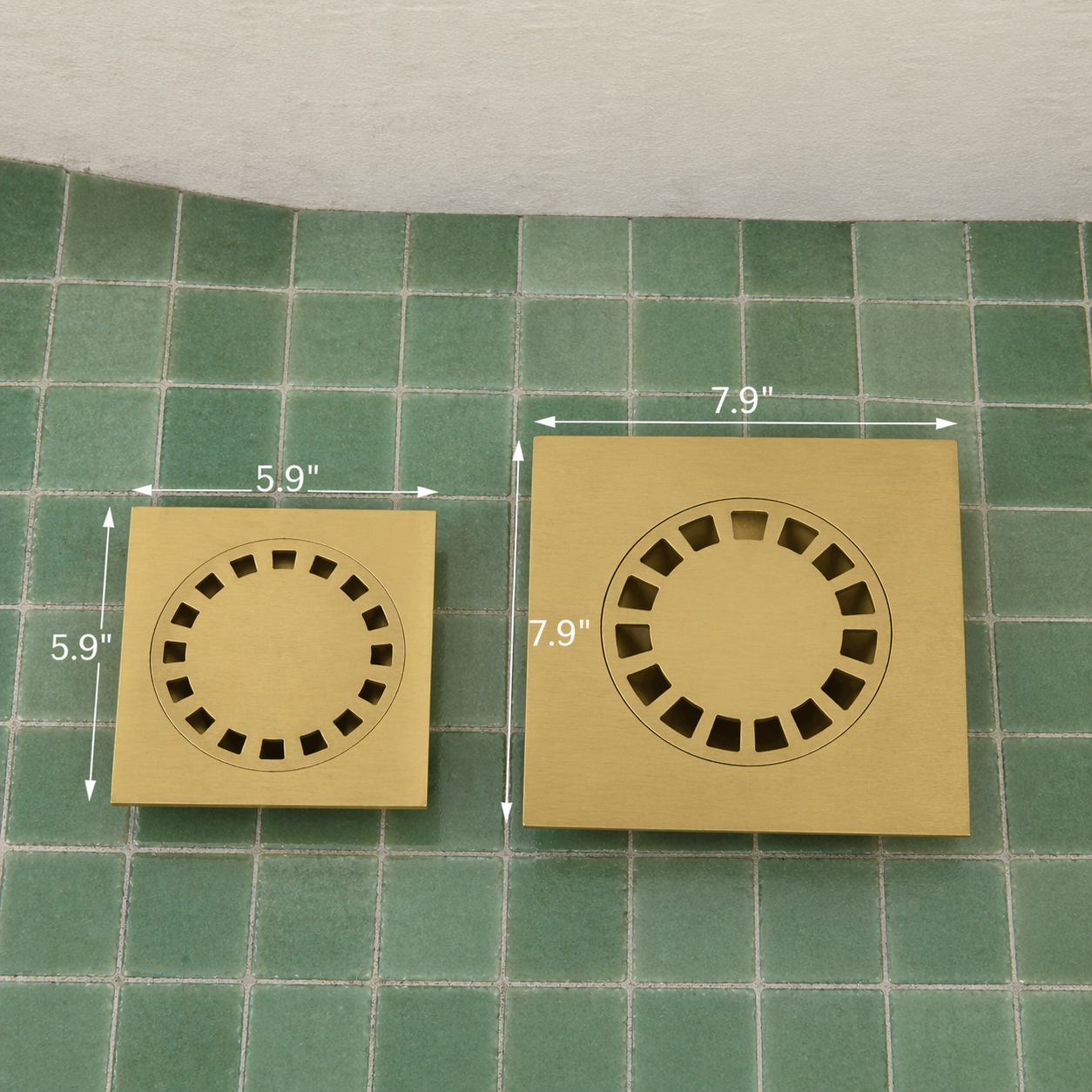 Handmade solid brass square shower floor drain with an unlacquered finish installed in a tiled shower floor.